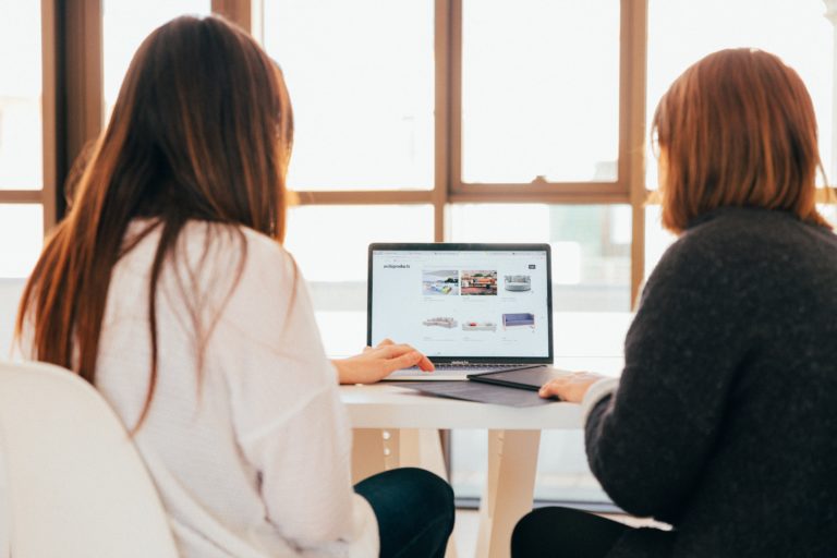 Two employees learning online