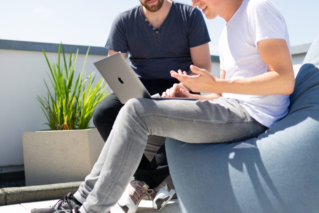 Two employees learning online